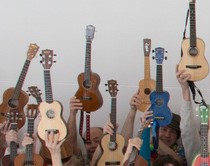 ukuleles in the air like they just don't care