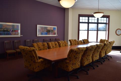 Conference room with large table and chairs