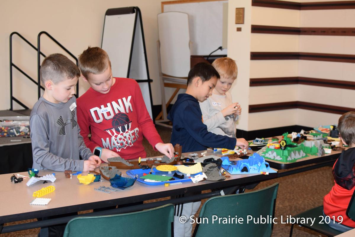 Children playing with LEGOs. 